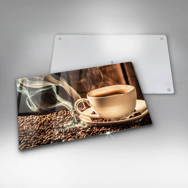 Tocător din sticlă ceașcă și boabe de cafea