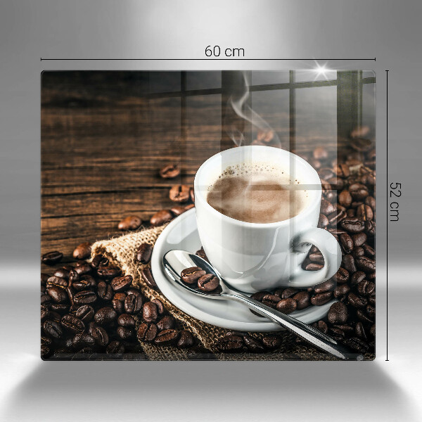 Tocător din sticlă ceașcă și boabe de cafea